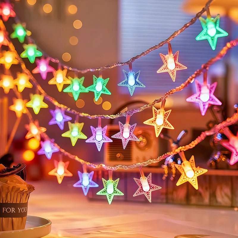 Multi-color LED star fairy string lights powered by batteries, perfect for adding a whimsical touch to any indoor or outdoor space. 3