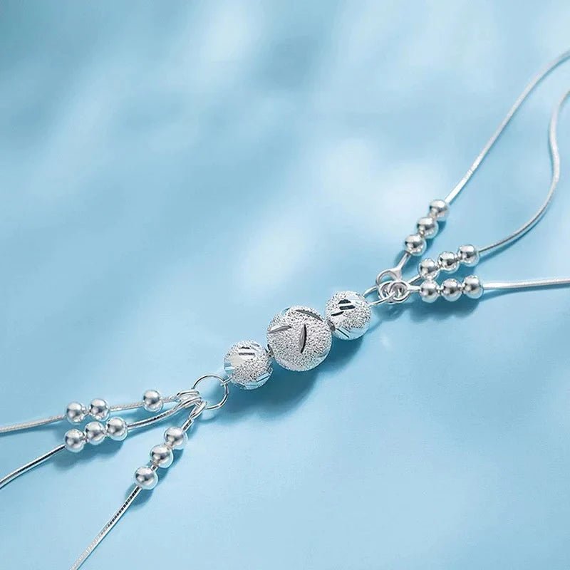Sterling silver adjustable bracelet featuring symbolic charms for luck, measuring 20cm in length. 3