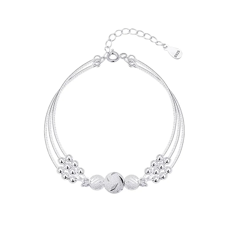 Sterling silver adjustable bracelet featuring symbolic charms for luck, measuring 20cm in length. 4