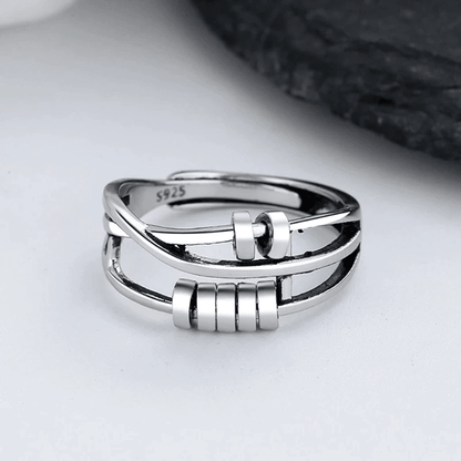 Sterling silver spinable anti-anxiety ring featuring an elegant design, adjustable size, and stress relief benefits, perfect for everyday wear. 0
