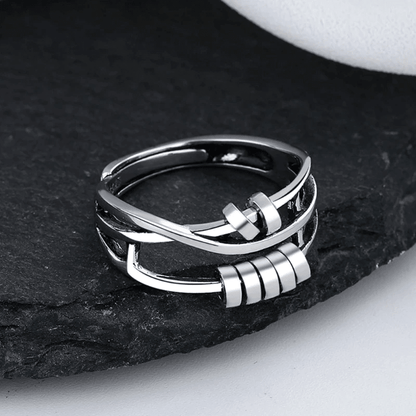 Sterling silver spinable anti-anxiety ring featuring an elegant design, adjustable size, and stress relief benefits, perfect for everyday wear. 2