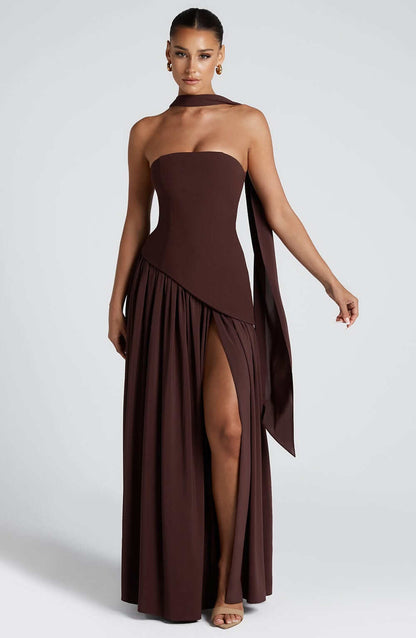 Strapless corset maxi gown featuring an asymmetrical draped skirt, perfect for elegant evening events and formal weddings. 8