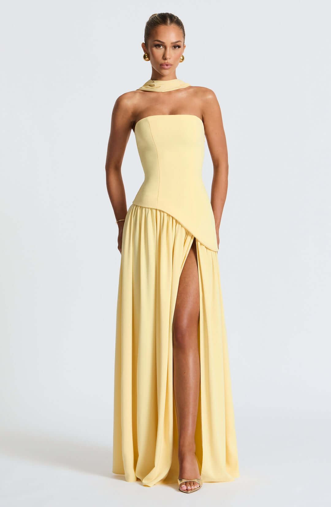 Strapless corset maxi gown featuring an asymmetrical draped skirt, perfect for elegant evening events and formal weddings. 4