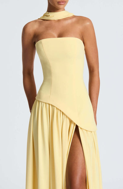 Strapless corset maxi gown featuring an asymmetrical draped skirt, perfect for elegant evening events and formal weddings. 5