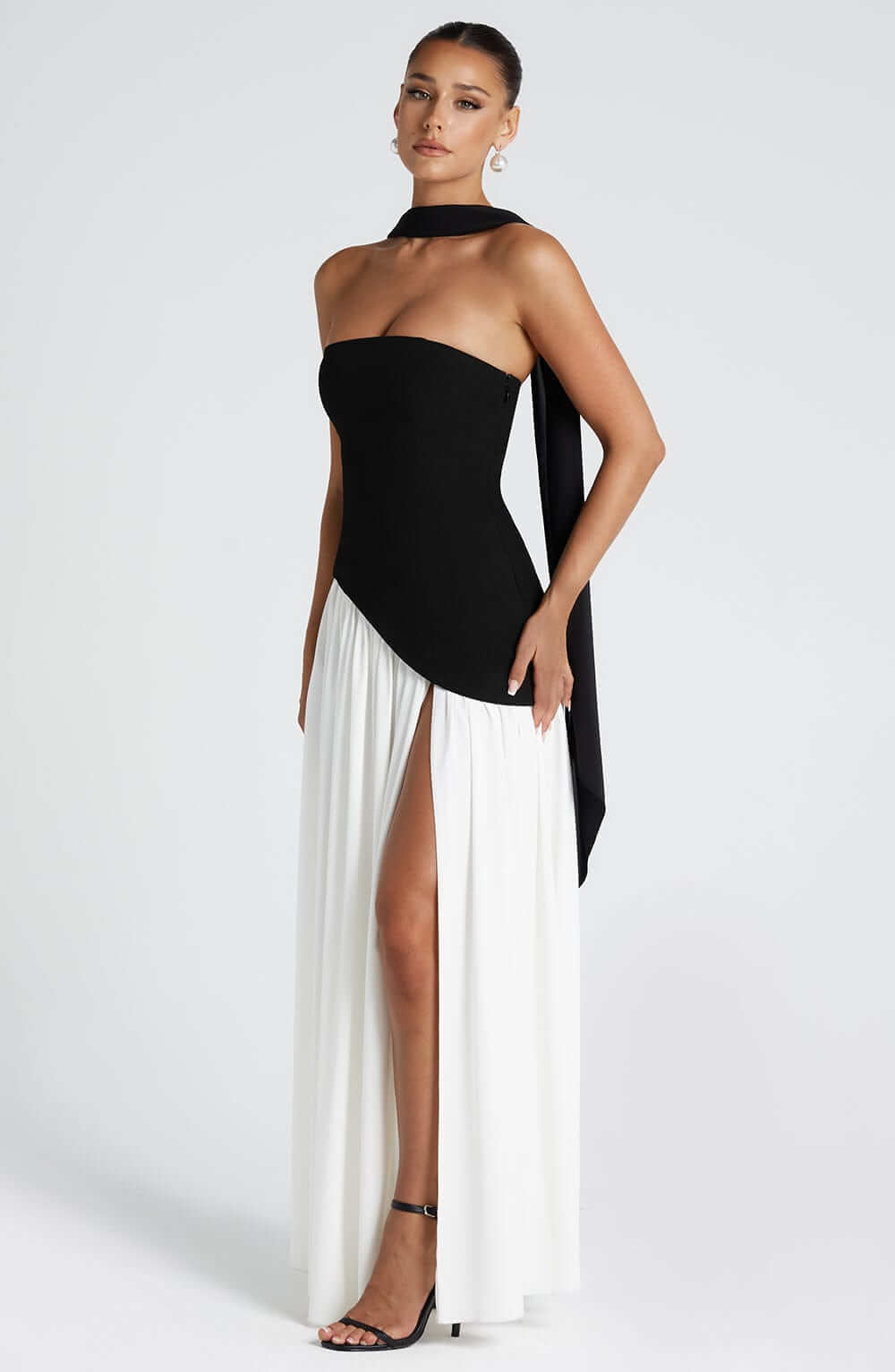 Strapless corset maxi gown featuring an asymmetrical draped skirt, perfect for elegant evening events and formal weddings. 2