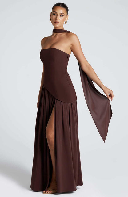Strapless corset maxi gown featuring an asymmetrical draped skirt, perfect for elegant evening events and formal weddings. 7