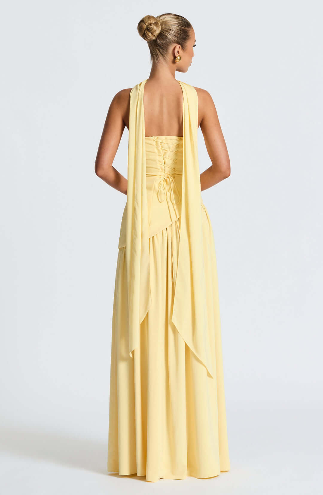 Strapless corset maxi gown featuring an asymmetrical draped skirt, perfect for elegant evening events and formal weddings. 6