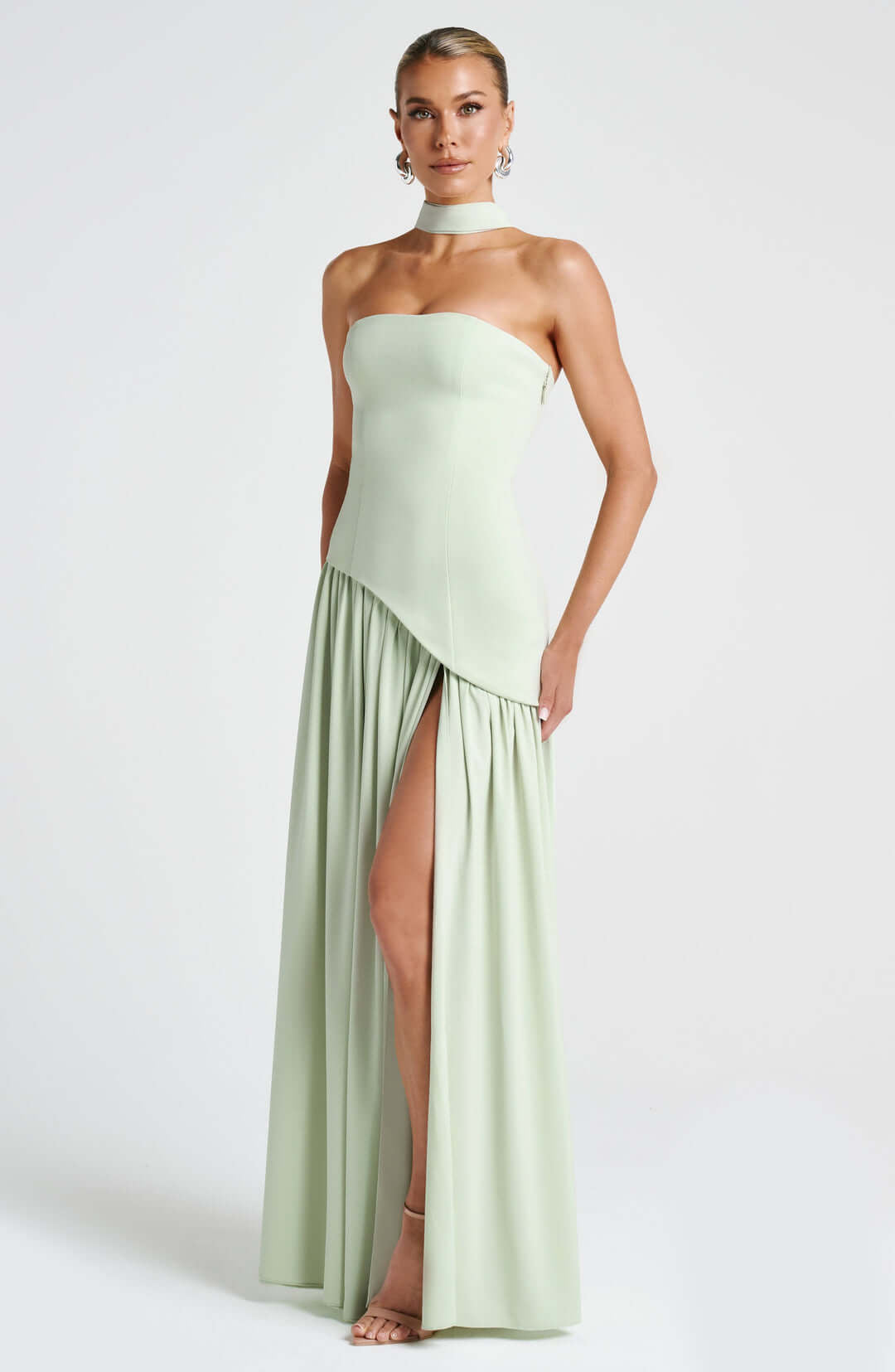 Strapless corset maxi gown featuring an asymmetrical draped skirt, perfect for elegant evening events and formal weddings. 3