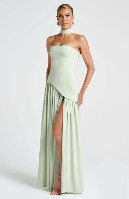 Strapless corset maxi gown featuring an asymmetrical draped skirt, perfect for elegant evening events and formal weddings. 3