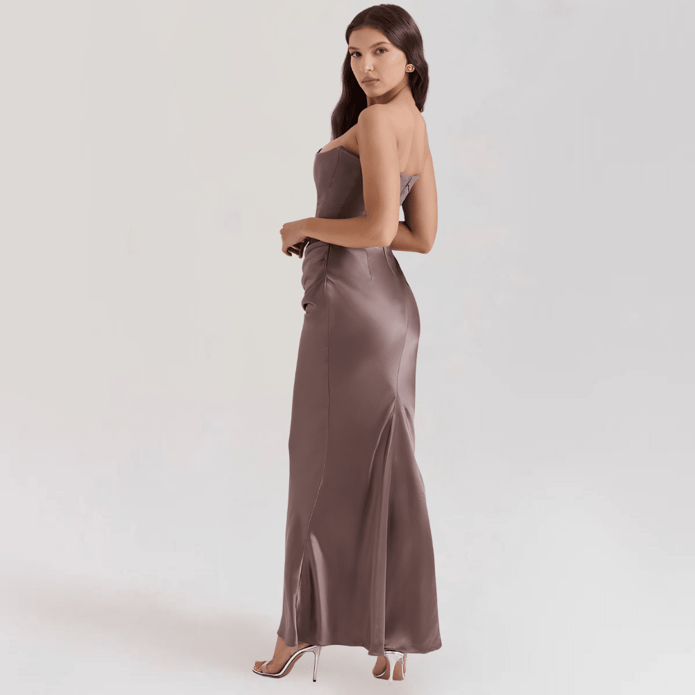 Strapless satin evening gown featuring a corset fit, elegantly designed for a floor-length formal look, perfect for special occasions and evening events. 1
