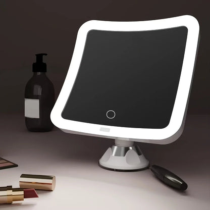 Suction cup makeup mirror featuring 10X magnification and dual LED lights, designed in white plastic and glass for a stylish vanity addition. 0