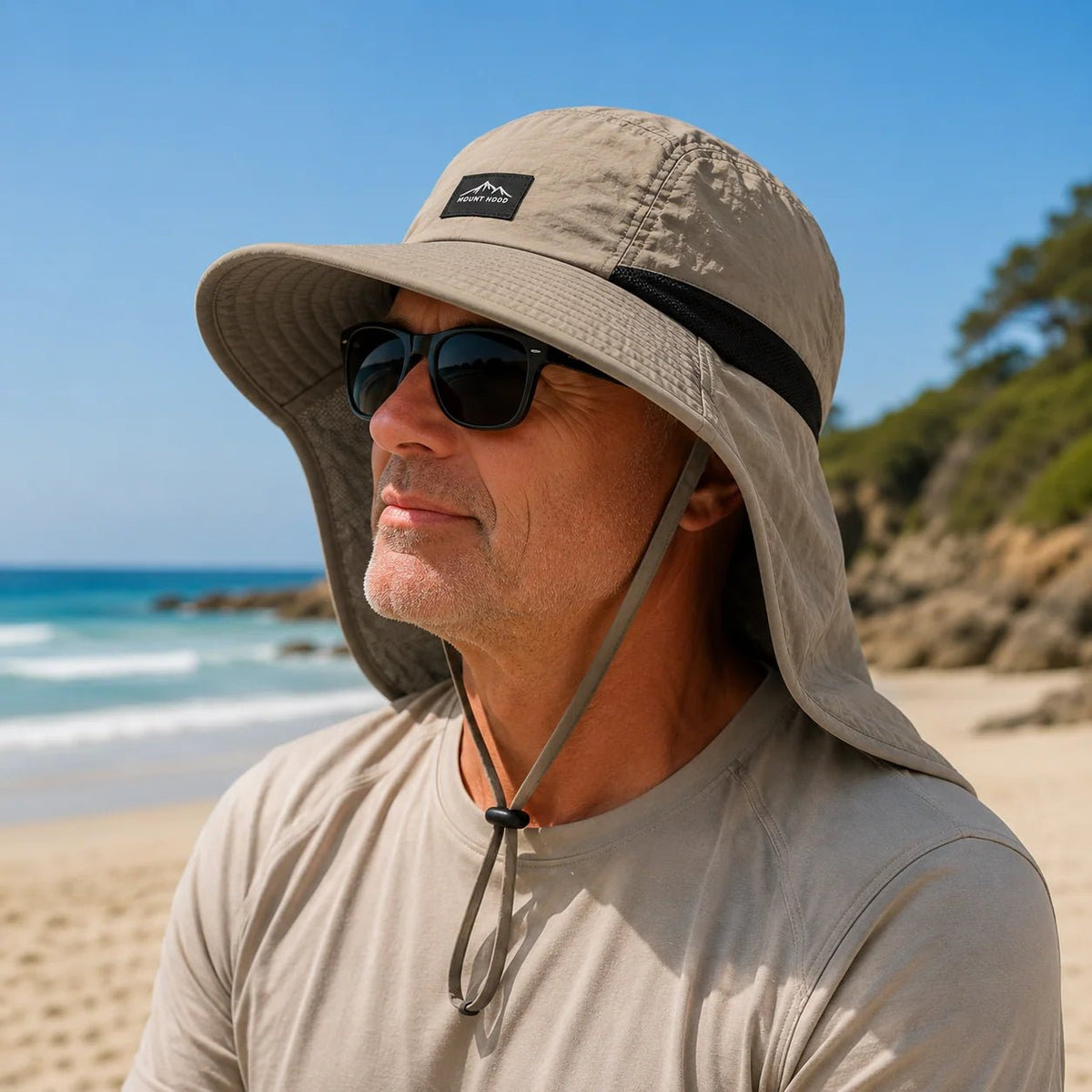 Sun hat with wide brim and neck flap, made of breathable nylon, offering UPF 50+ sun protection for outdoor activities. 0