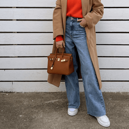 Synthetic leather handbag featuring a spacious interior and elegant design, perfect for organizing essentials for work and travel. 4