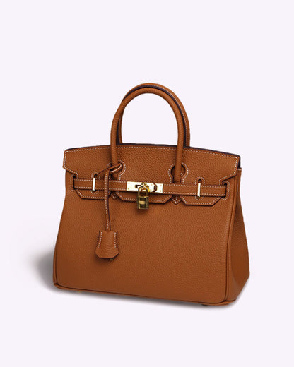 Synthetic leather handbag featuring a spacious interior and elegant design, perfect for organizing essentials for work and travel. 2