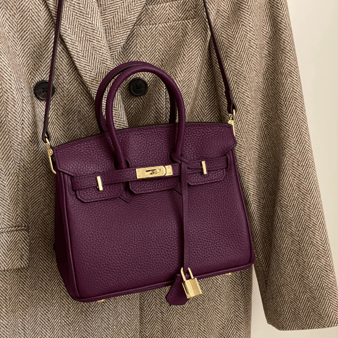 Synthetic leather handbag featuring a spacious interior and elegant design, perfect for organizing essentials for work and travel. 8