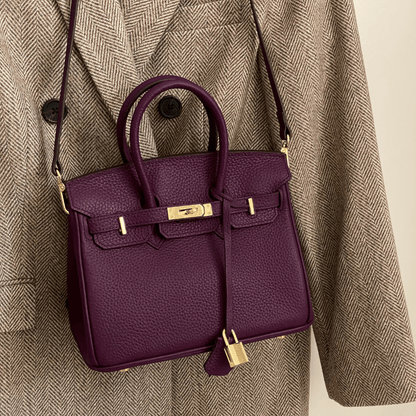 Synthetic leather handbag featuring a spacious interior and elegant design, perfect for organizing essentials for work and travel. 8