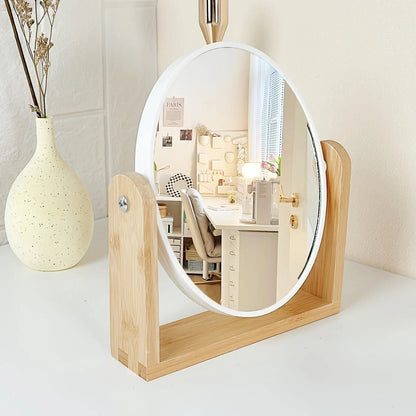 Tabletop makeup mirror featuring a double-sided rotating design with a magnifying side, elegantly framed in natural bamboo, perfect for a stylish vanity setup. 3