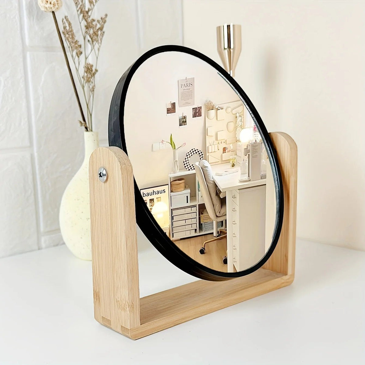 Tabletop makeup mirror featuring a double-sided rotating design with a magnifying side, elegantly framed in natural bamboo, perfect for a stylish vanity setup. 2