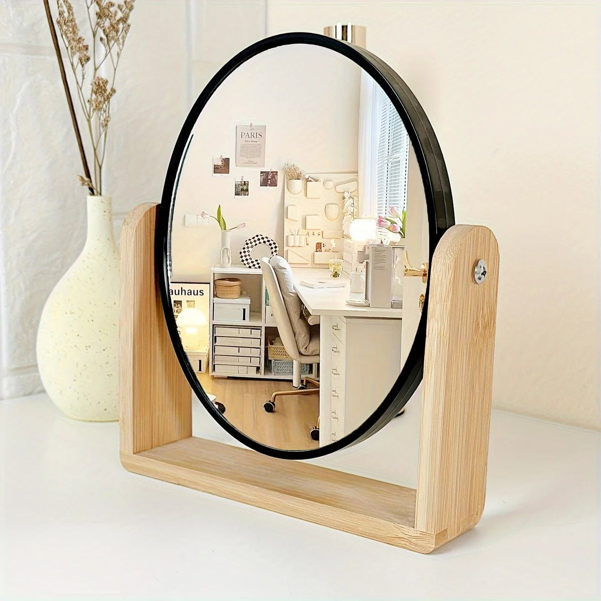 Tabletop makeup mirror featuring a double-sided rotating design with a magnifying side, elegantly framed in natural bamboo, perfect for a stylish vanity setup. 1
