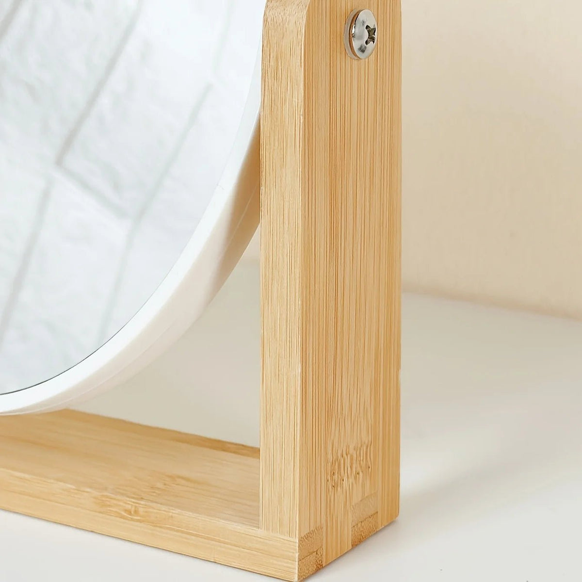 Tabletop makeup mirror featuring a double-sided rotating design with a magnifying side, elegantly framed in natural bamboo, perfect for a stylish vanity setup. 6