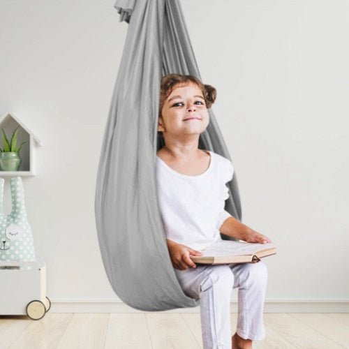 Therapeutic sensory swing for children designed to support focus and provide a calming experience, featuring easy assembly and durable materials. 3