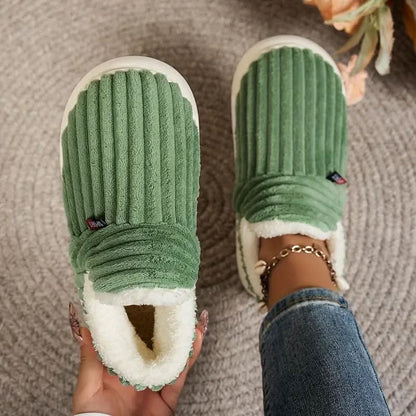Cozy thermal women's slippers featuring a non-slip sole and insulating interior, perfect for keeping feet warm and comfortable at home. 0
