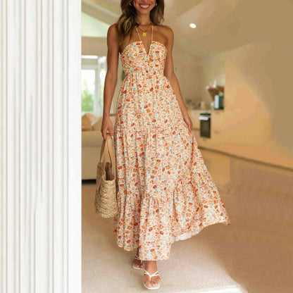 Tiered maxi dress featuring an adjustable halter neckline, made from lightweight breathable fabric, perfect for both casual and formal occasions. 2