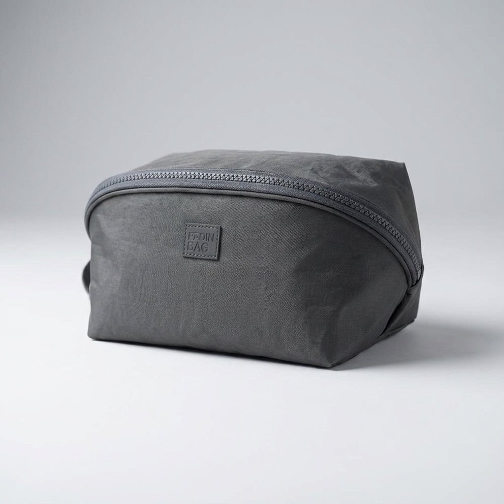 Light pink nylon travel toiletry bag featuring smart compartments and a wide opening, perfect for organizing cosmetics and personal care items while on the go. 7
