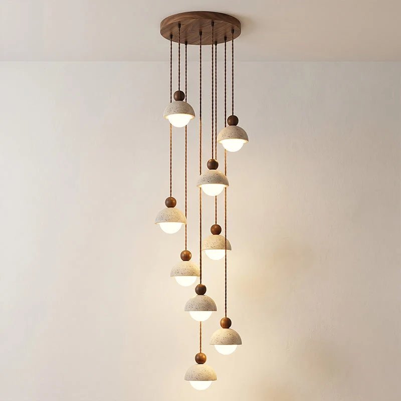 Travertine pendant light featuring a glass shade and wood accent, ideal for modern kitchen lighting over an island or dining table. 19