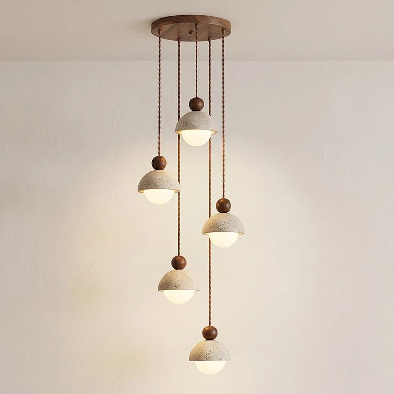 Travertine pendant light featuring a glass shade and wood accent, ideal for modern kitchen lighting over an island or dining table. 9