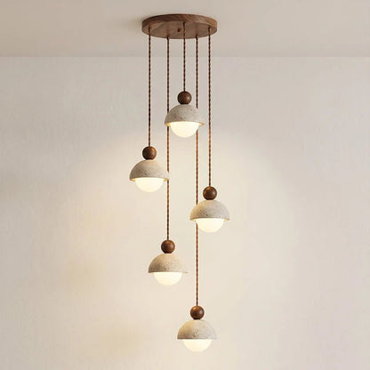 Travertine pendant light featuring a glass shade and wood accent, ideal for modern kitchen lighting over an island or dining table. 9