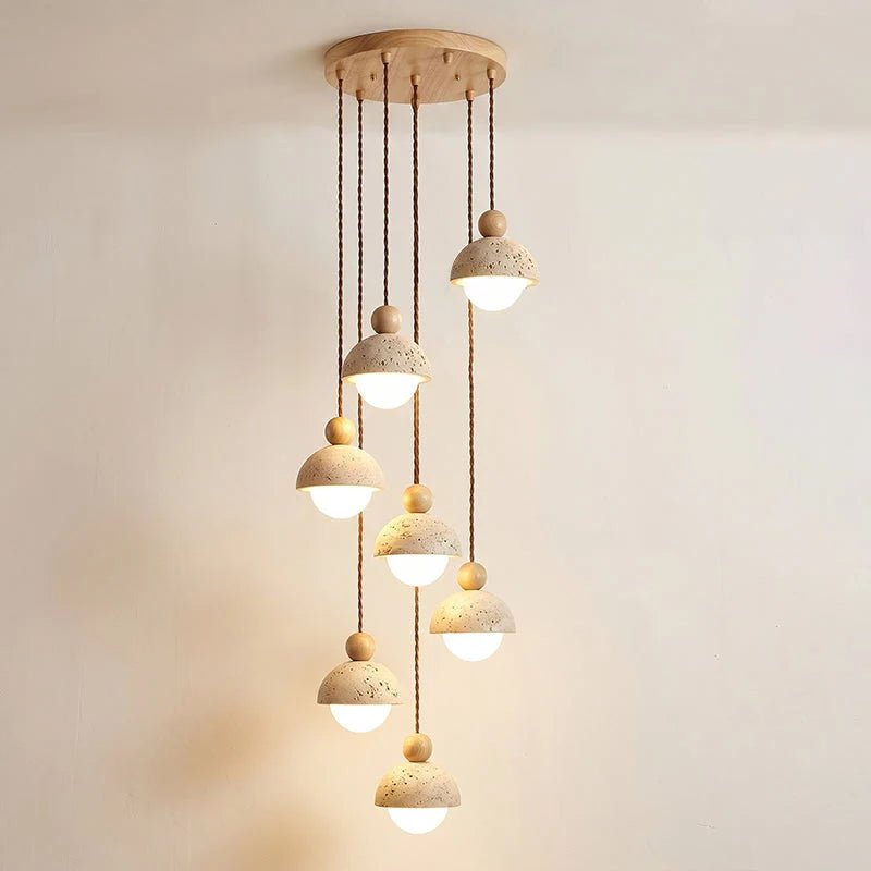 Travertine pendant light featuring a glass shade and wood accent, ideal for modern kitchen lighting over an island or dining table. 24