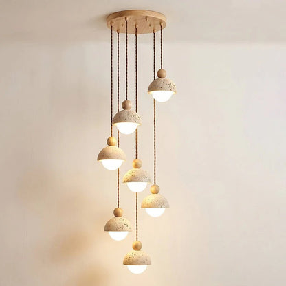 Travertine pendant light featuring a glass shade and wood accent, ideal for modern kitchen lighting over an island or dining table. 24