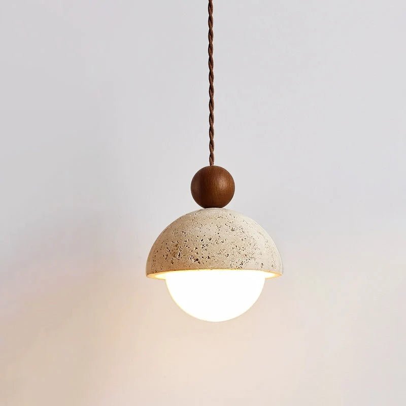 Travertine pendant light featuring a glass shade and wood accent, ideal for modern kitchen lighting over an island or dining table. 16