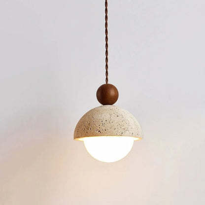 Travertine pendant light featuring a glass shade and wood accent, ideal for modern kitchen lighting over an island or dining table. 16