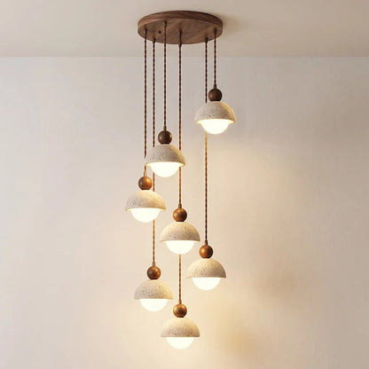 Travertine pendant light featuring a glass shade and wood accent, ideal for modern kitchen lighting over an island or dining table. 25