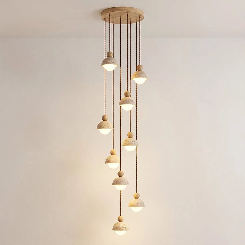Travertine pendant light featuring a glass shade and wood accent, ideal for modern kitchen lighting over an island or dining table. 15
