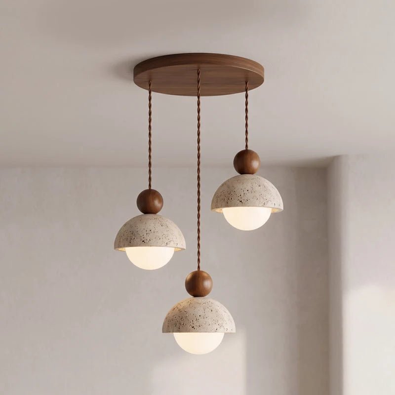 Travertine pendant light featuring a glass shade and wood accent, ideal for modern kitchen lighting over an island or dining table. 23