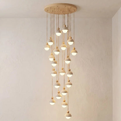 Travertine pendant light featuring a glass shade and wood accent, ideal for modern kitchen lighting over an island or dining table. 11