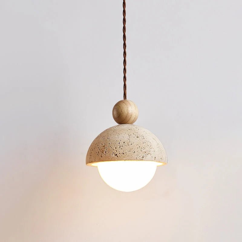 Travertine pendant light featuring a glass shade and wood accent, ideal for modern kitchen lighting over an island or dining table. 0