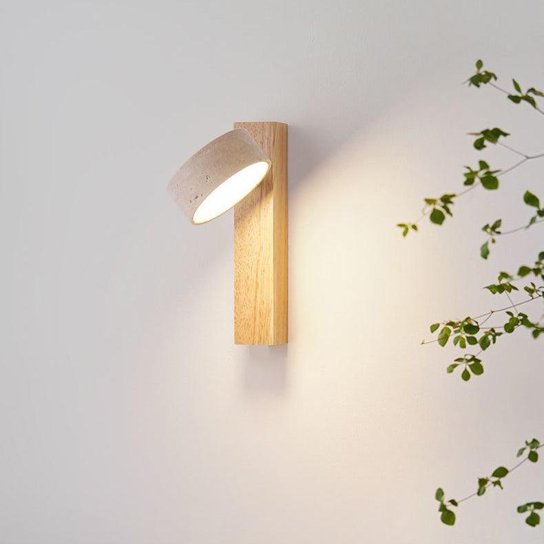 Travertine wall lamp featuring a swivel LED design with a minimalist stone and wood aesthetic, emitting a soft ivory light for elegant home decor. 5