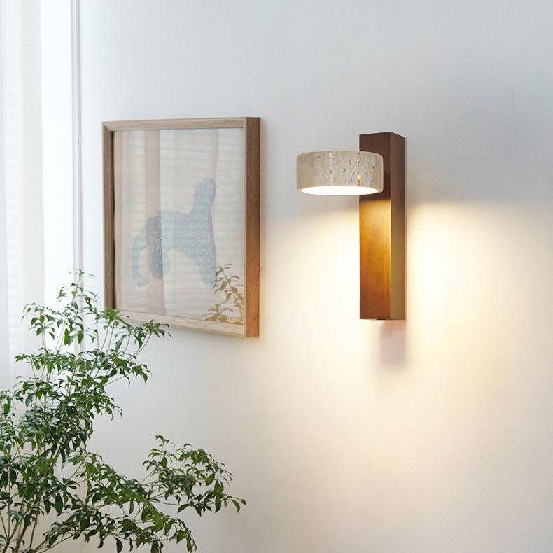 Travertine wall lamp featuring a swivel LED design with a minimalist stone and wood aesthetic, emitting a soft ivory light for elegant home decor. 3