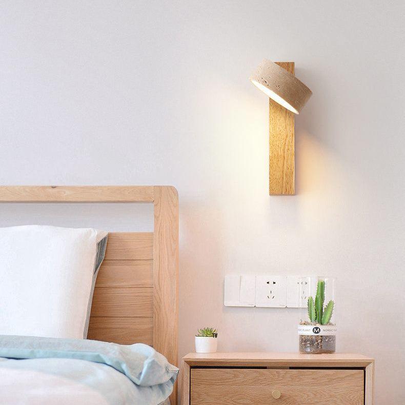 Travertine wall lamp featuring a swivel LED design with a minimalist stone and wood aesthetic, emitting a soft ivory light for elegant home decor. 6
