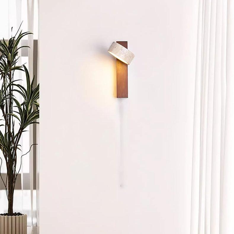 Travertine wall lamp featuring a swivel LED design with a minimalist stone and wood aesthetic, emitting a soft ivory light for elegant home decor. 4