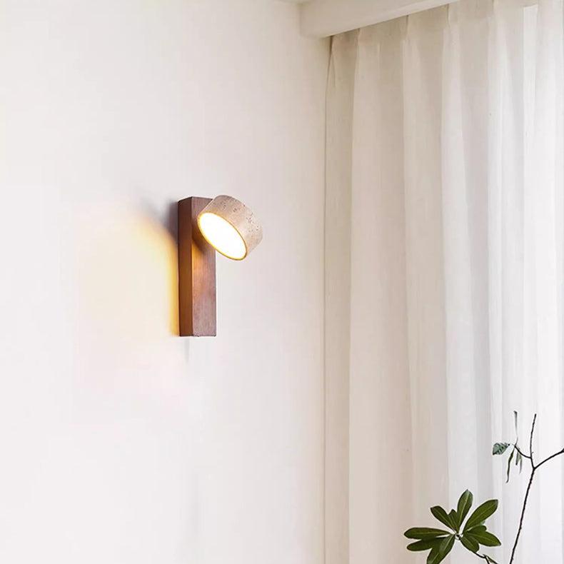 Travertine wall lamp featuring a swivel LED design with a minimalist stone and wood aesthetic, emitting a soft ivory light for elegant home decor. 7