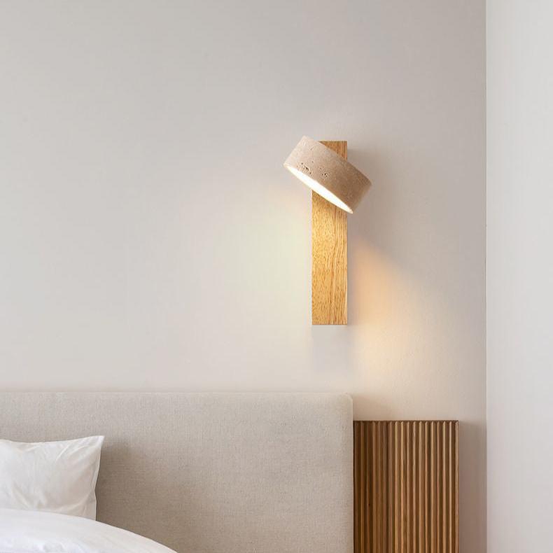 Travertine wall lamp featuring a swivel LED design with a minimalist stone and wood aesthetic, emitting a soft ivory light for elegant home decor. 8