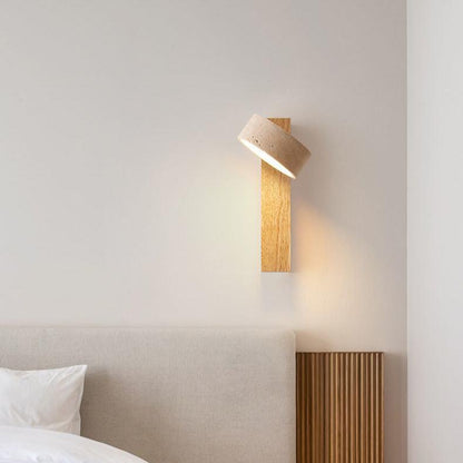Travertine wall lamp featuring a swivel LED design with a minimalist stone and wood aesthetic, emitting a soft ivory light for elegant home decor. 8