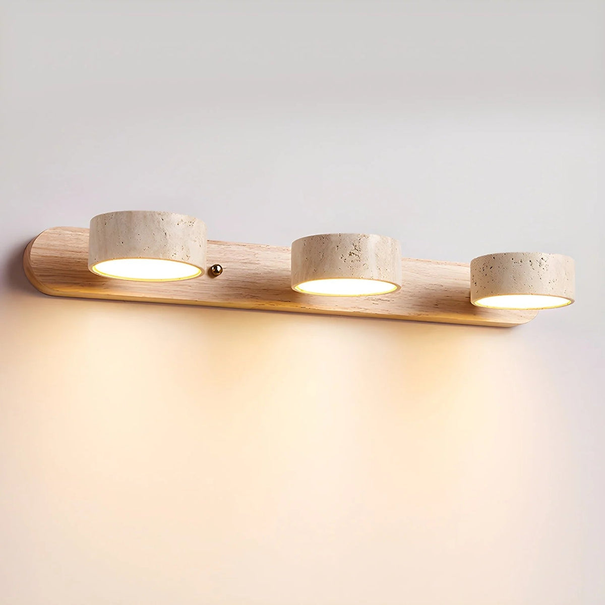 Travertine wall light with integrated LED, showcasing a warm ambient glow, ideal for bathroom and hallway decor, featuring a natural stone design. 10