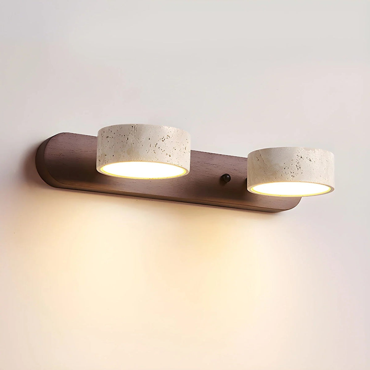 Travertine wall light with integrated LED, showcasing a warm ambient glow, ideal for bathroom and hallway decor, featuring a natural stone design. 0