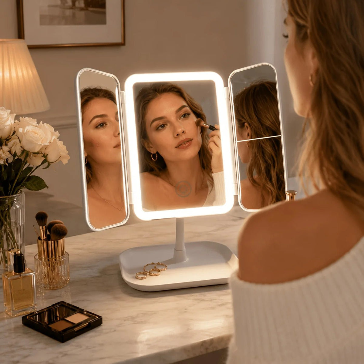Tri-fold makeup mirror in white and pink featuring a touch light and 1X, 2X, 3X magnification for enhanced makeup application 2